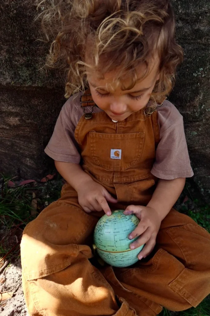 Toddler playing outdoors at Sunshine Mini School early learning centre, Tingalpa